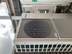 Photo of a heat pump on top of a building