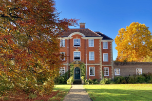 Photo by Chelsea Wallis - Pathway, orange tree, fellows lawn and a building at LMH