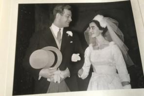 A black and white photo of a young couple getting married