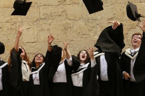 Graduates throwing their hats in the air