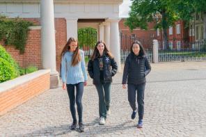 Students walking outside the front gate at LMH