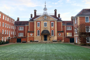 Talbot Hall, an imposing red brick building with a spire, on a frosty morning