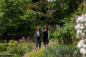 Two female students in garden