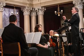 Conductor Pawel Kotla stands in the National Philharmonic of Ukraine in Kyiv conducting a special 'Concert for Freedom'