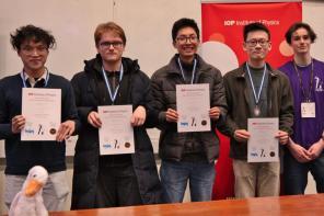 Four male students holding certificates and wearing medals at the PLANCKS preliminaries 2025