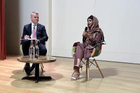 Malala Yousafzai sitting next to Professor Stephen Blyth