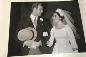 A black and white photo of a young couple getting married