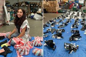 Photo of Sukhneel Jaspal in the Care4Calais warehouse preparing packages for refugees