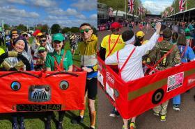 A group of people dressed as a London bus running the London Marathon