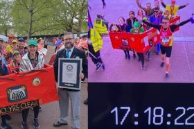 A group of people dressed as a London bus running the London Marathon