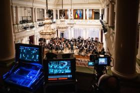 A birds-eye view of the Concert for Freedom and Solidarity in the National Philharmonic of Ukraine. In the foreground is recording and media equipment.