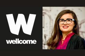 A headshot of Professor Ana Domingos, a woman with long dark brown hair who wears glasses and a pink top alongside the Wellcome Trust logo