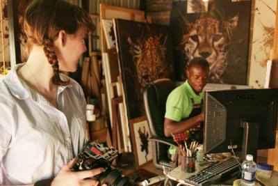 Photo of two people working in an art studio