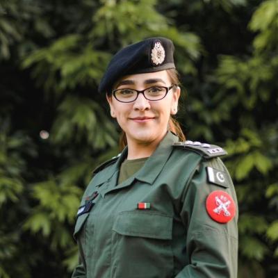 Phot of Amna Baig in a deep green uniform