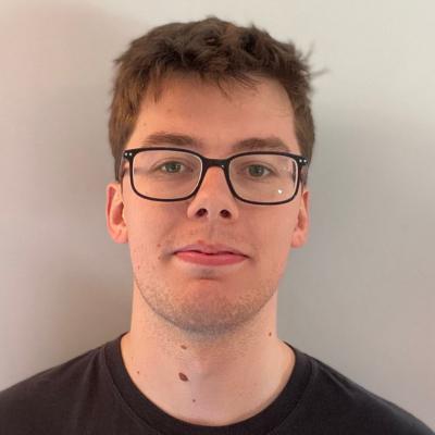 Daniel Cubbin, who has short brown hair and glasses