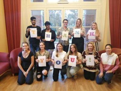 Photo of a group of students holding up letters spelling out 'thank you'