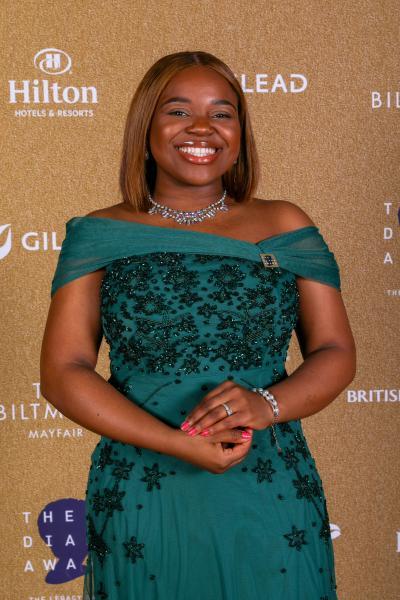 Vee Kathivu wearing a green dress at an awards ceremony