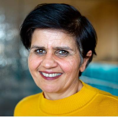 Prof Monima Chadha, who has short dark hair and is wearing a yellow top