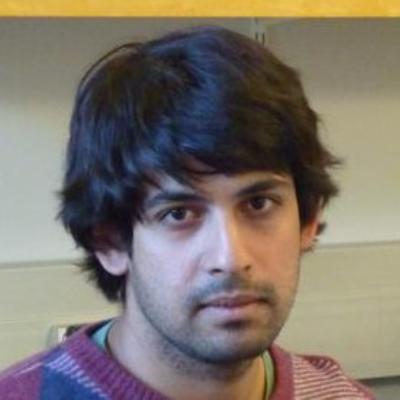 Portrait photo of Dr Varun Kanade, who has dark hair