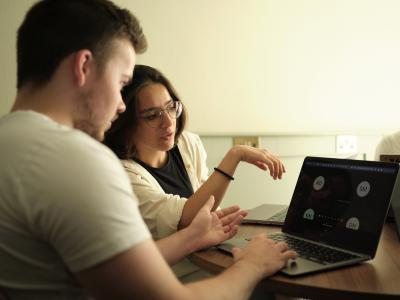 Two student looking at screen