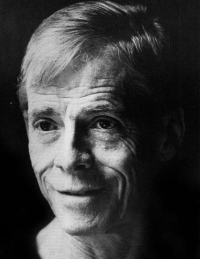 A black and white photo of James Merrill